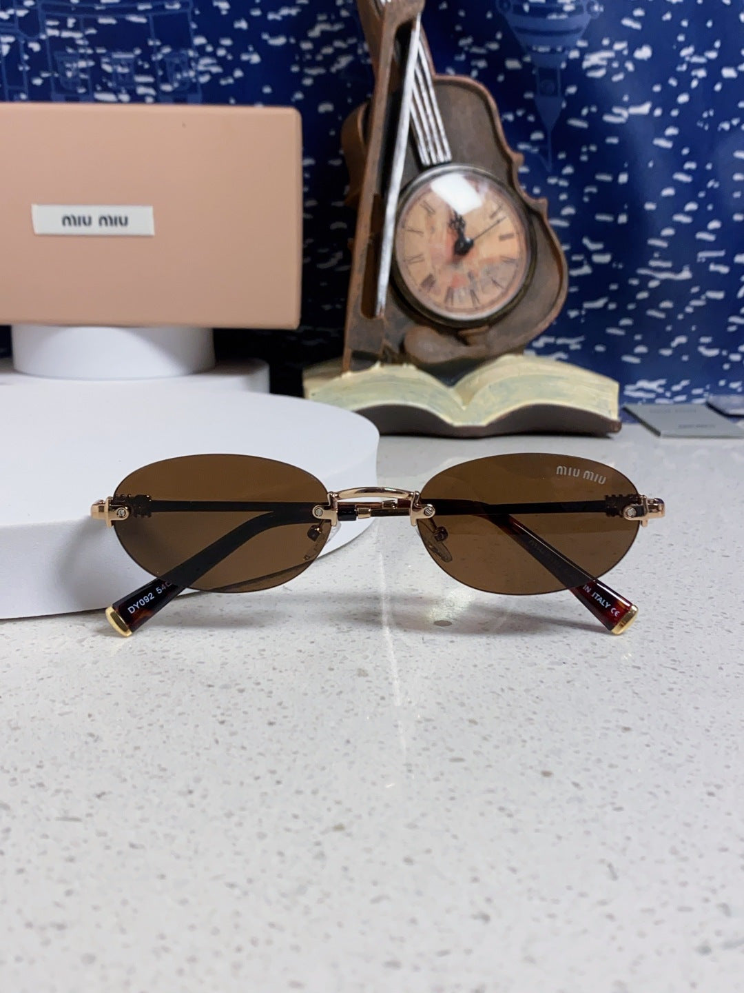 Miu Miu Lightweight Metal Rimless Brown Lens Sunglasses for Women - detail image 9