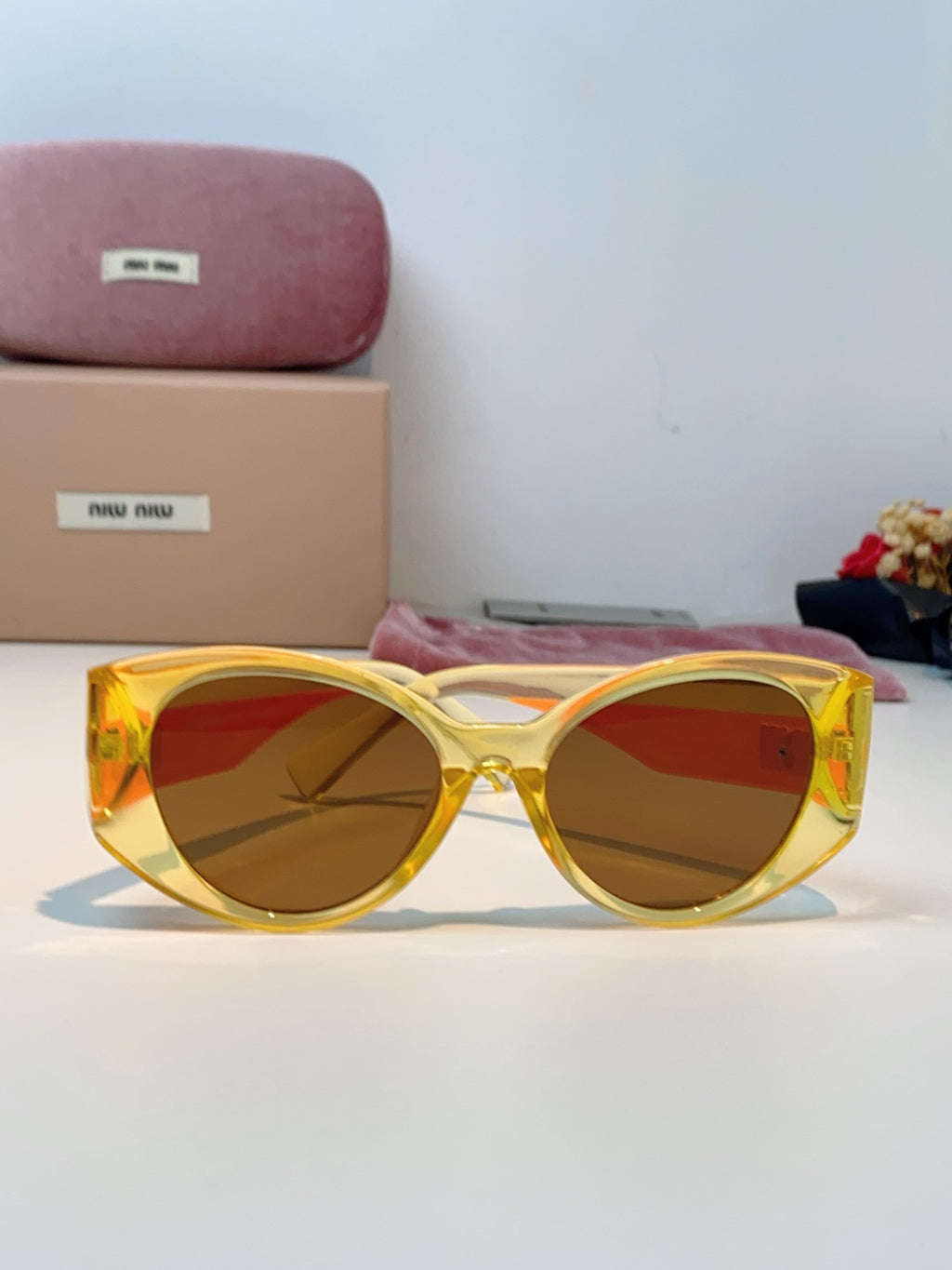 Miu Miu Polarized Cat-Eye Orange Lens Sunglasses for Men & Women - detail image 2