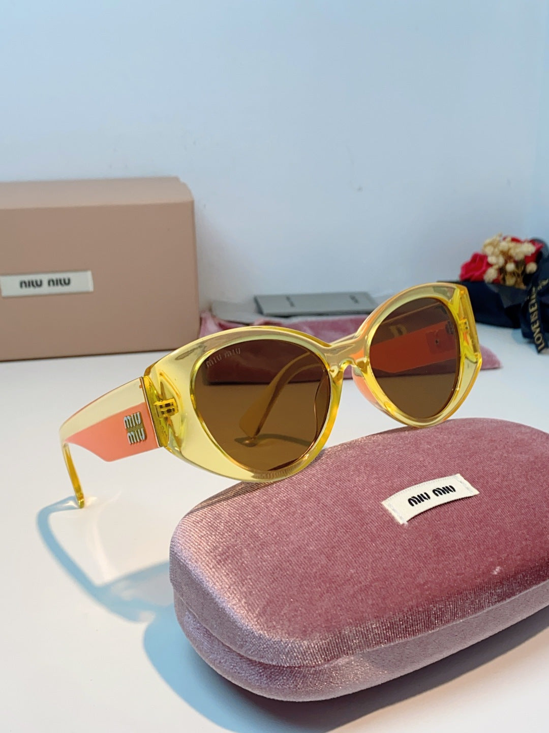 Miu Miu Polarized Cat-Eye Orange Lens Sunglasses for Men & Women - detail image 10
