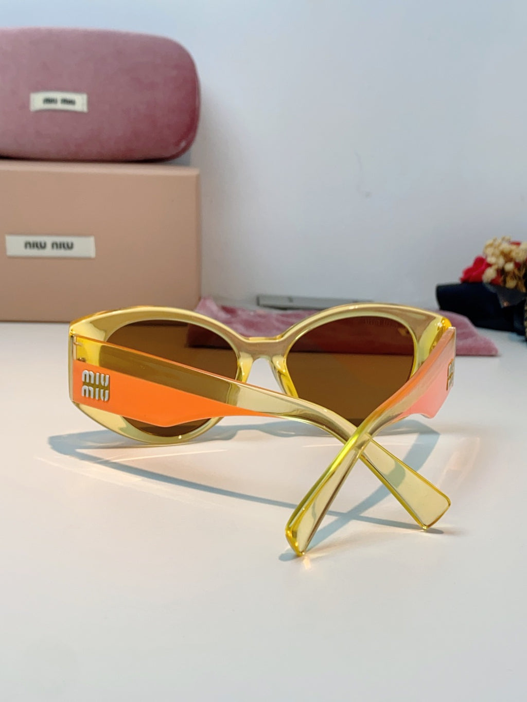 Miu Miu Polarized Cat-Eye Orange Lens Sunglasses for Men & Women - detail image 3
