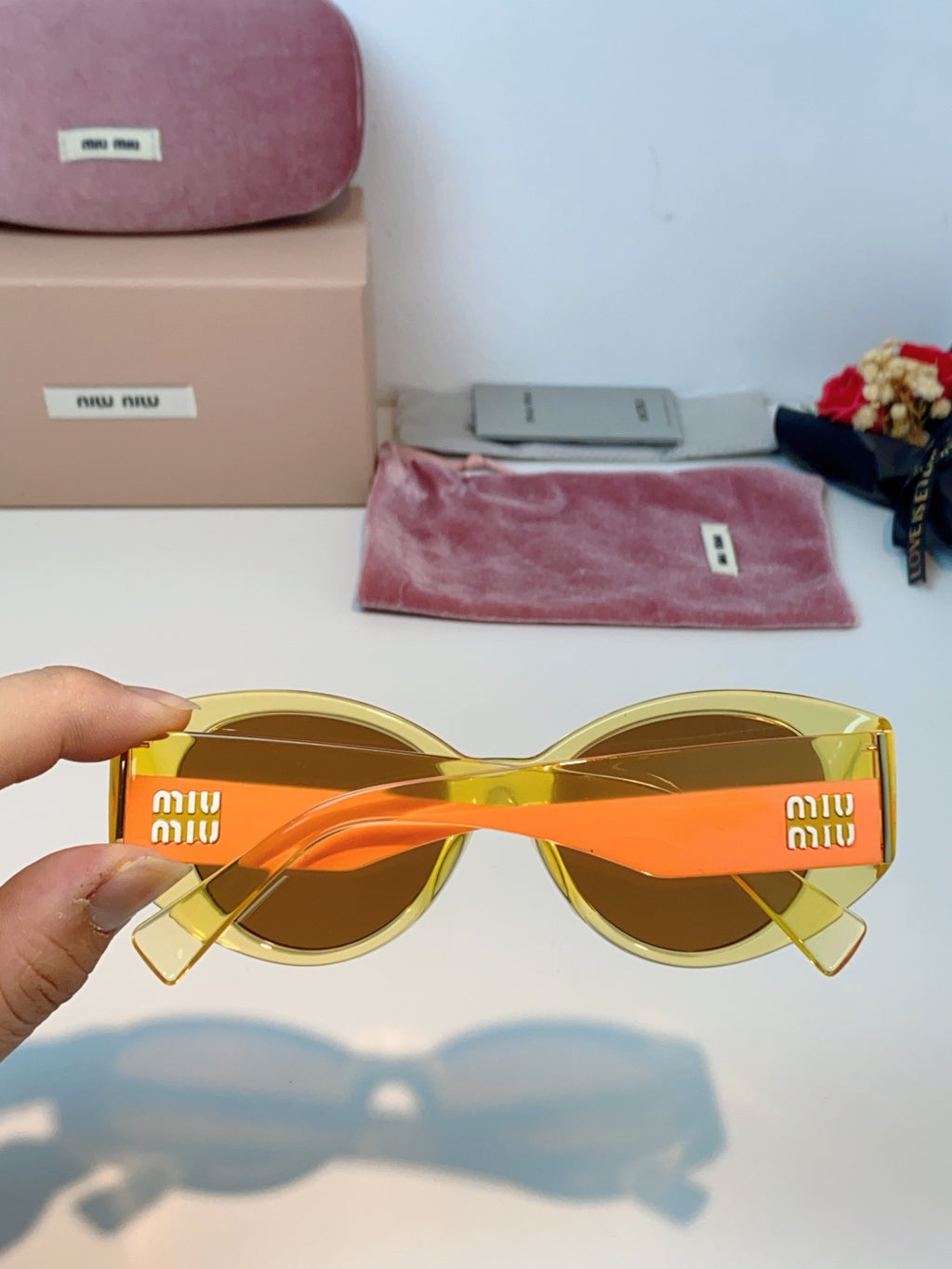 Miu Miu Polarized Cat-Eye Orange Lens Sunglasses for Men & Women - detail image 5