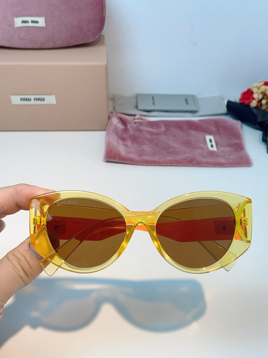 Miu Miu Polarized Cat-Eye Orange Lens Sunglasses for Men & Women - detail image 4