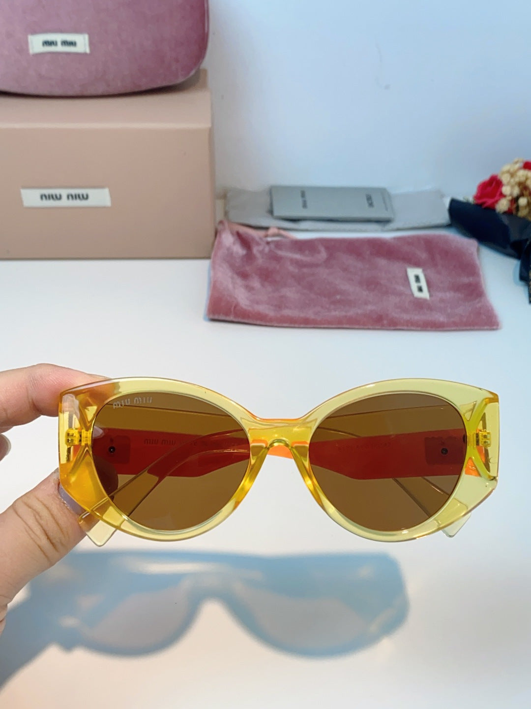 Miu Miu Polarized Cat-Eye Orange Lens Sunglasses for Men & Women - detail image 4