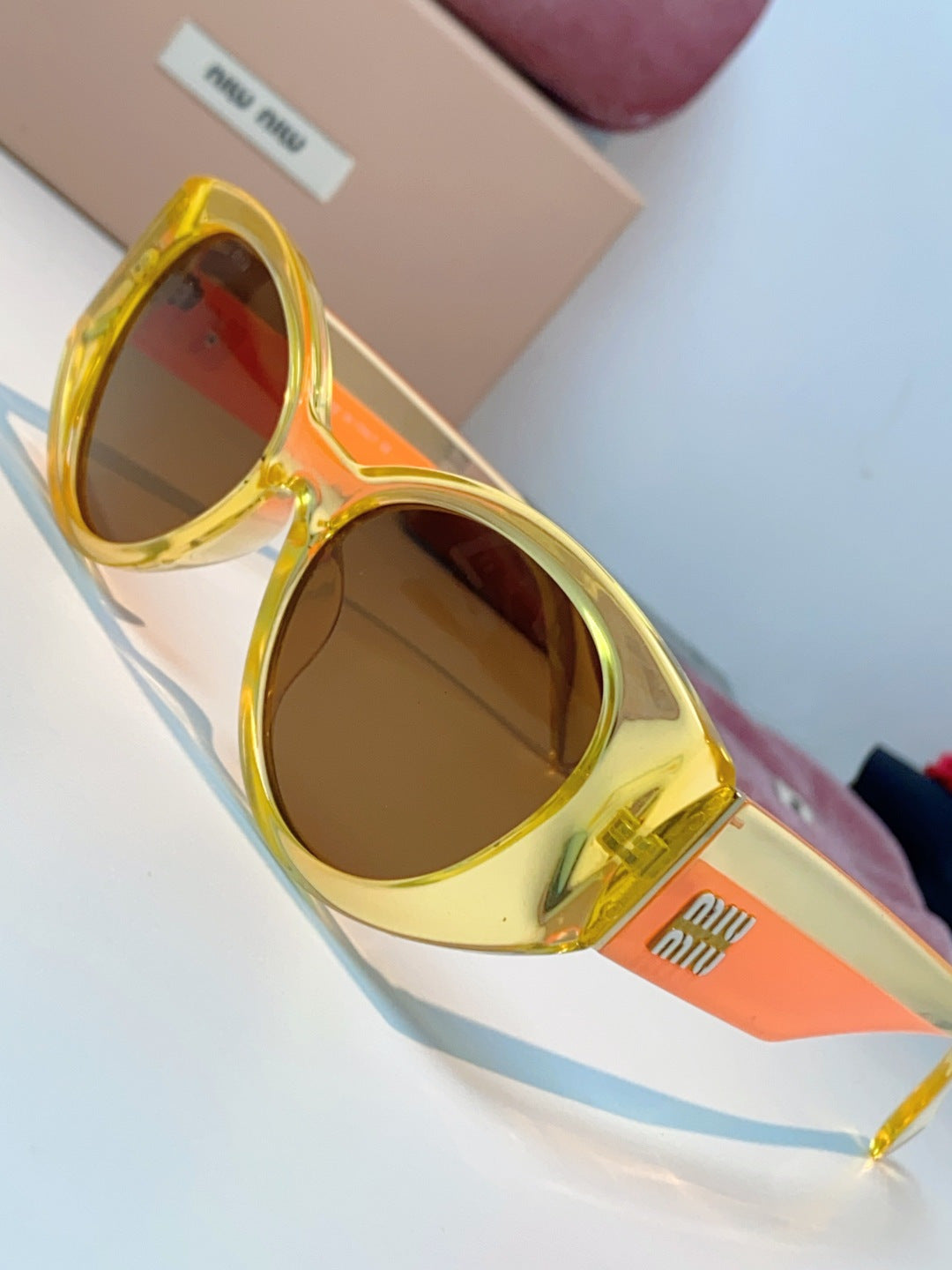 Miu Miu Polarized Cat-Eye Orange Lens Sunglasses for Men & Women - detail image 7
