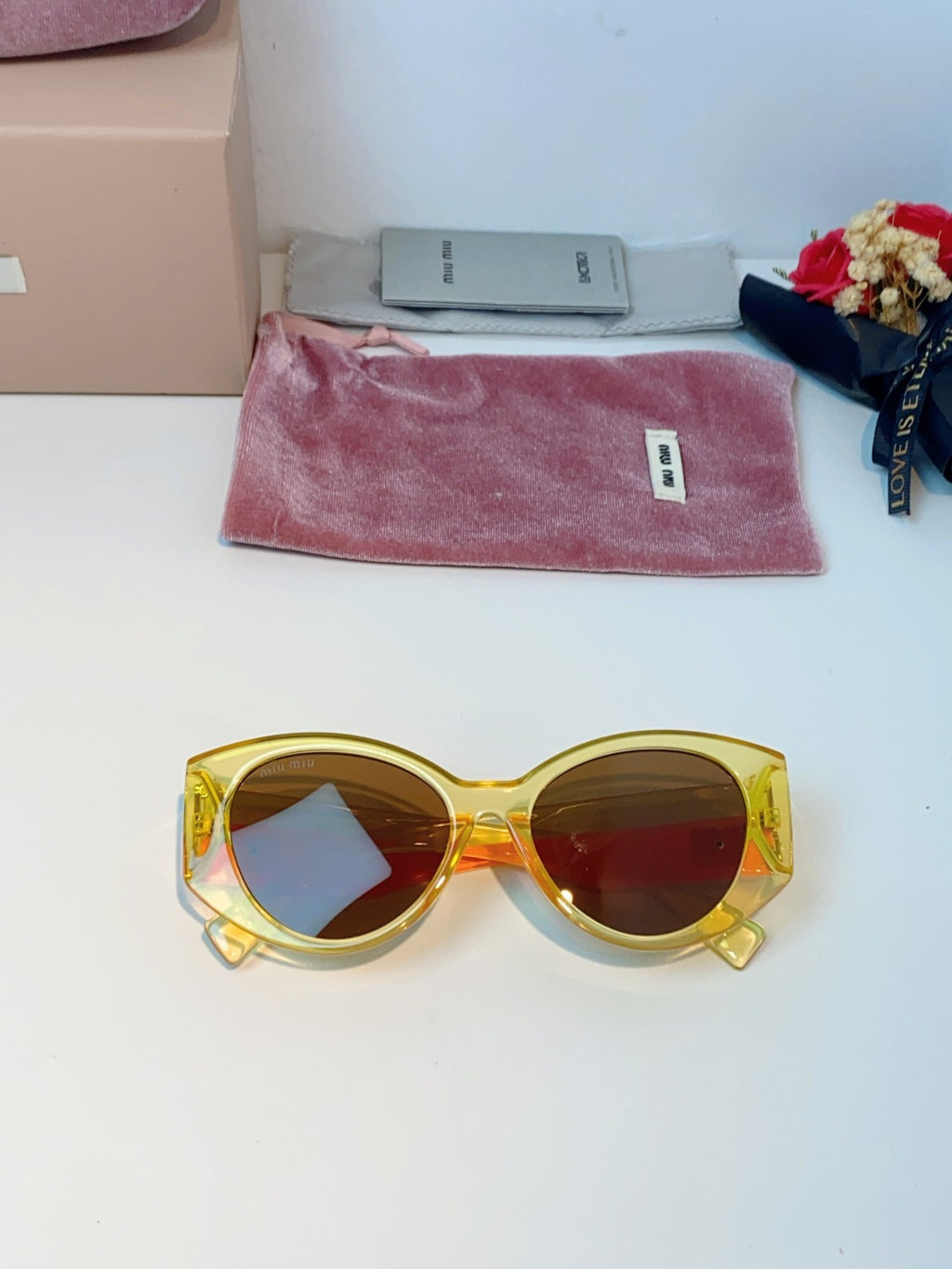 Miu Miu Polarized Cat-Eye Orange Lens Sunglasses for Men & Women - detail image 9