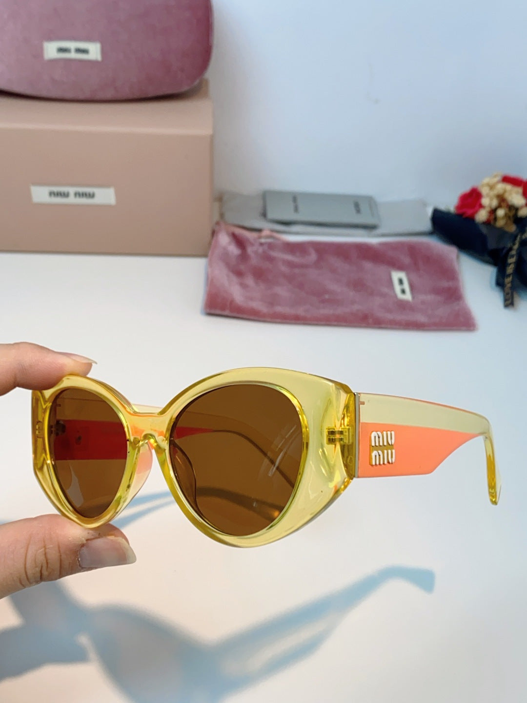 Miu Miu Polarized Cat-Eye Orange Lens Sunglasses for Men & Women - detail image 6
