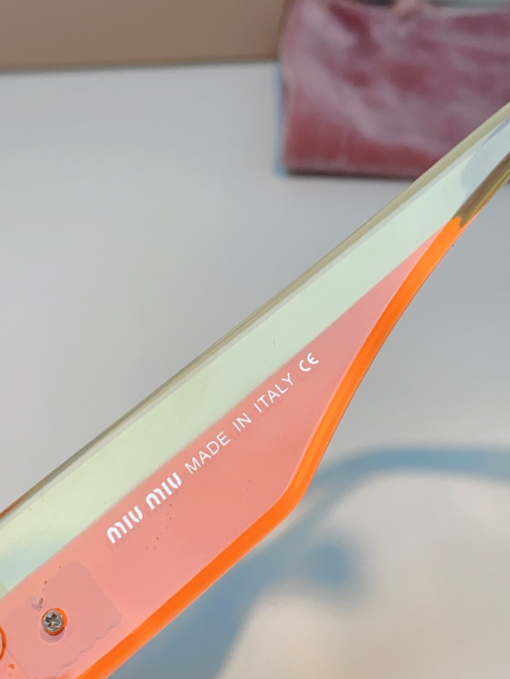 Miu Miu Polarized Cat-Eye Orange Lens Sunglasses for Men & Women - detail image 8