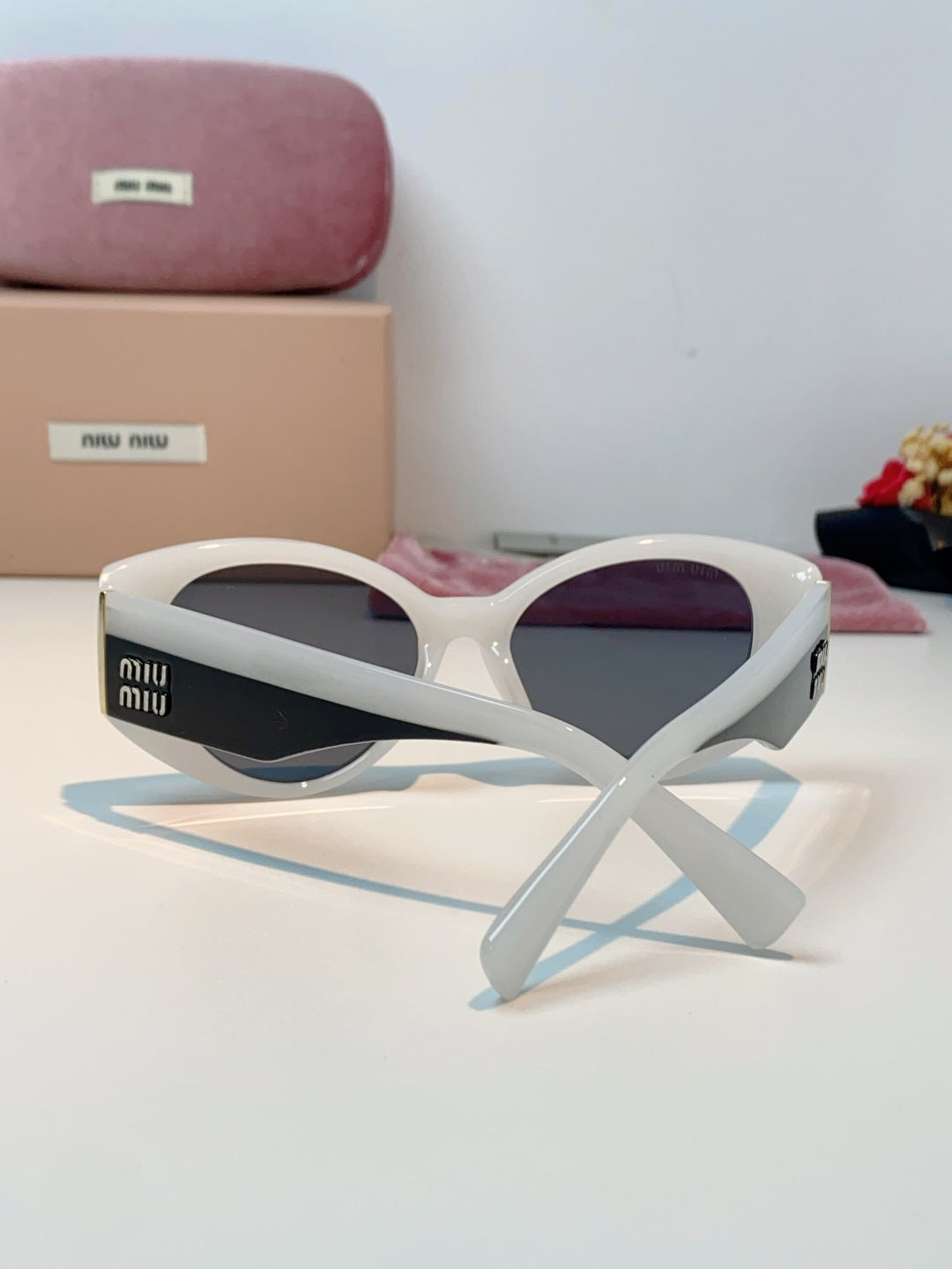 Miu Miu Polarized Cat-Eye Gray Lens Sunglasses for Men & Women - detail image 3