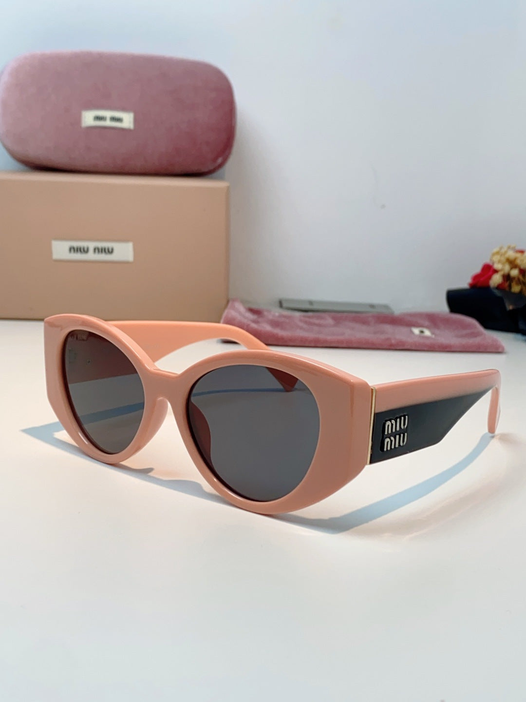 Miu Miu Polarized Cat-Eye Red Lens Sunglasses for Men & Women