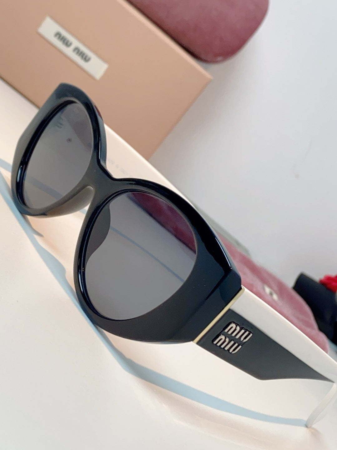 Miu Miu Polarized Cat-Eye Blue Lens Sunglasses for Men & Women - detail image 7