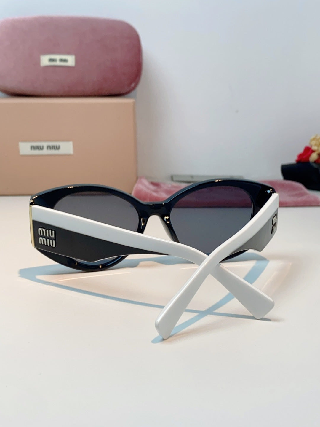 Miu Miu Polarized Cat-Eye Blue Lens Sunglasses for Men & Women - detail image 3