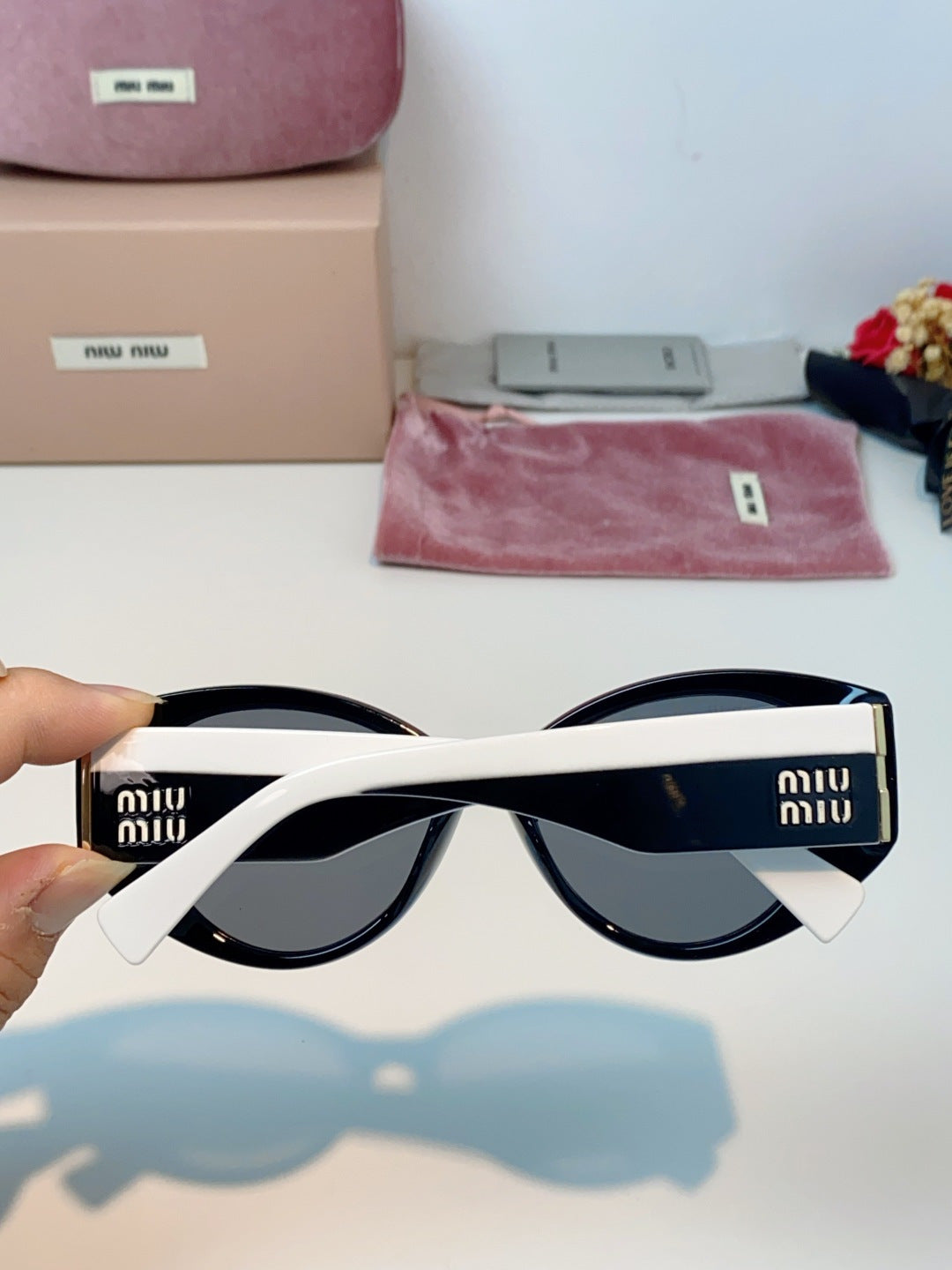 Miu Miu Polarized Cat-Eye Blue Lens Sunglasses for Men & Women - detail image 5
