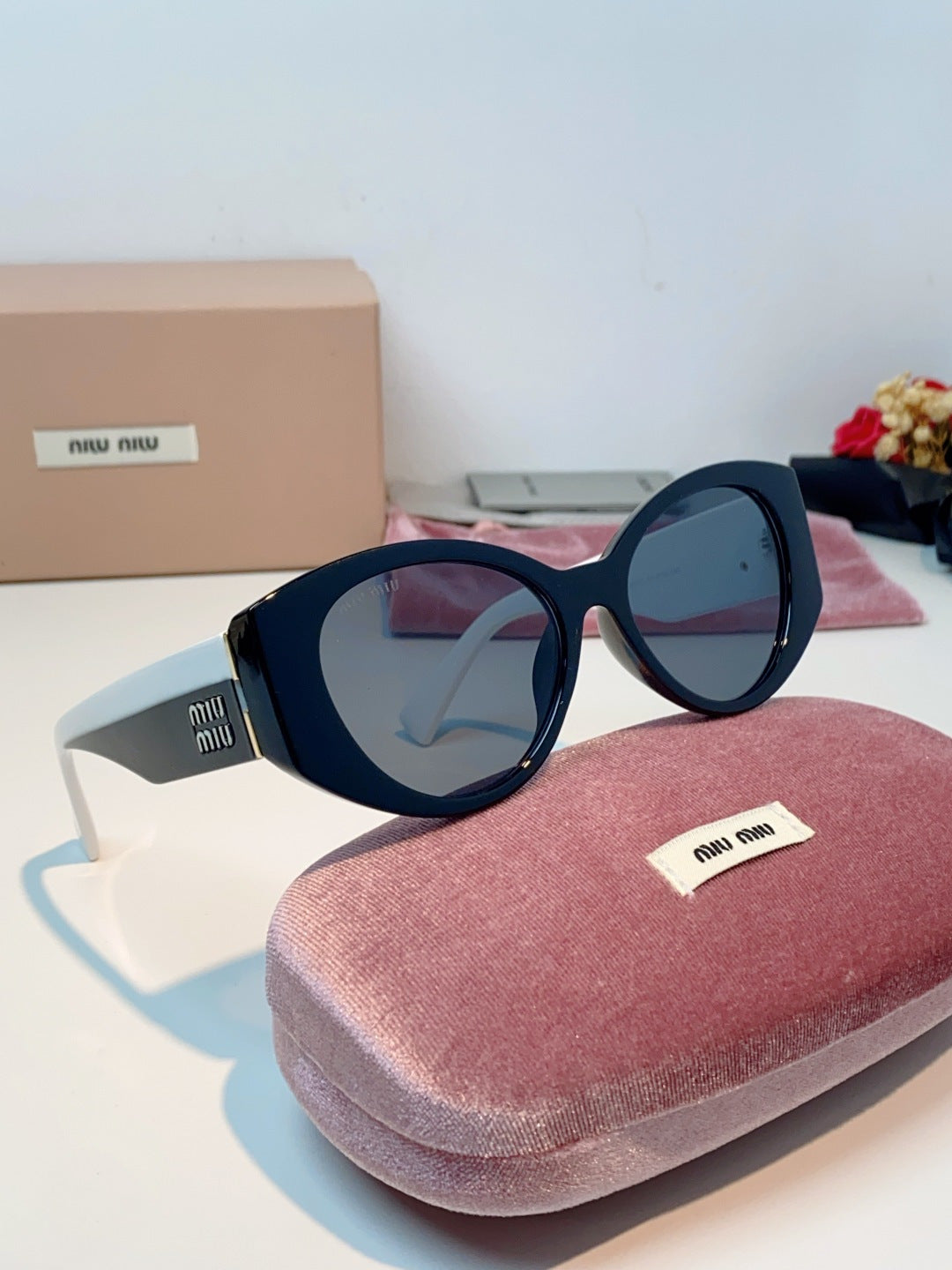 Miu Miu Polarized Cat-Eye Blue Lens Sunglasses for Men & Women - detail image 10