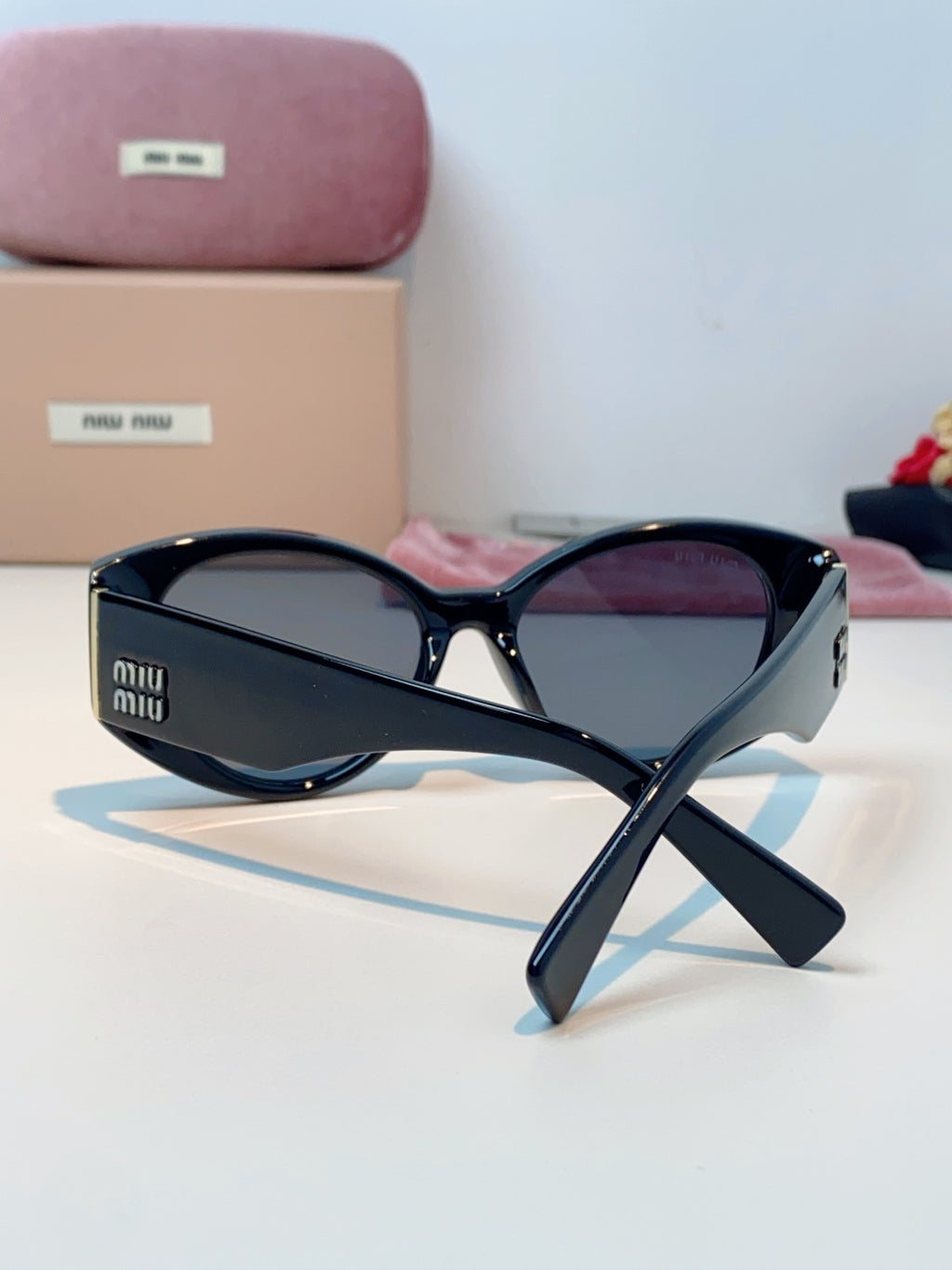 Miu Miu Polarized Cat-Eye Black Lens Sunglasses for Men & Women - detail image 3