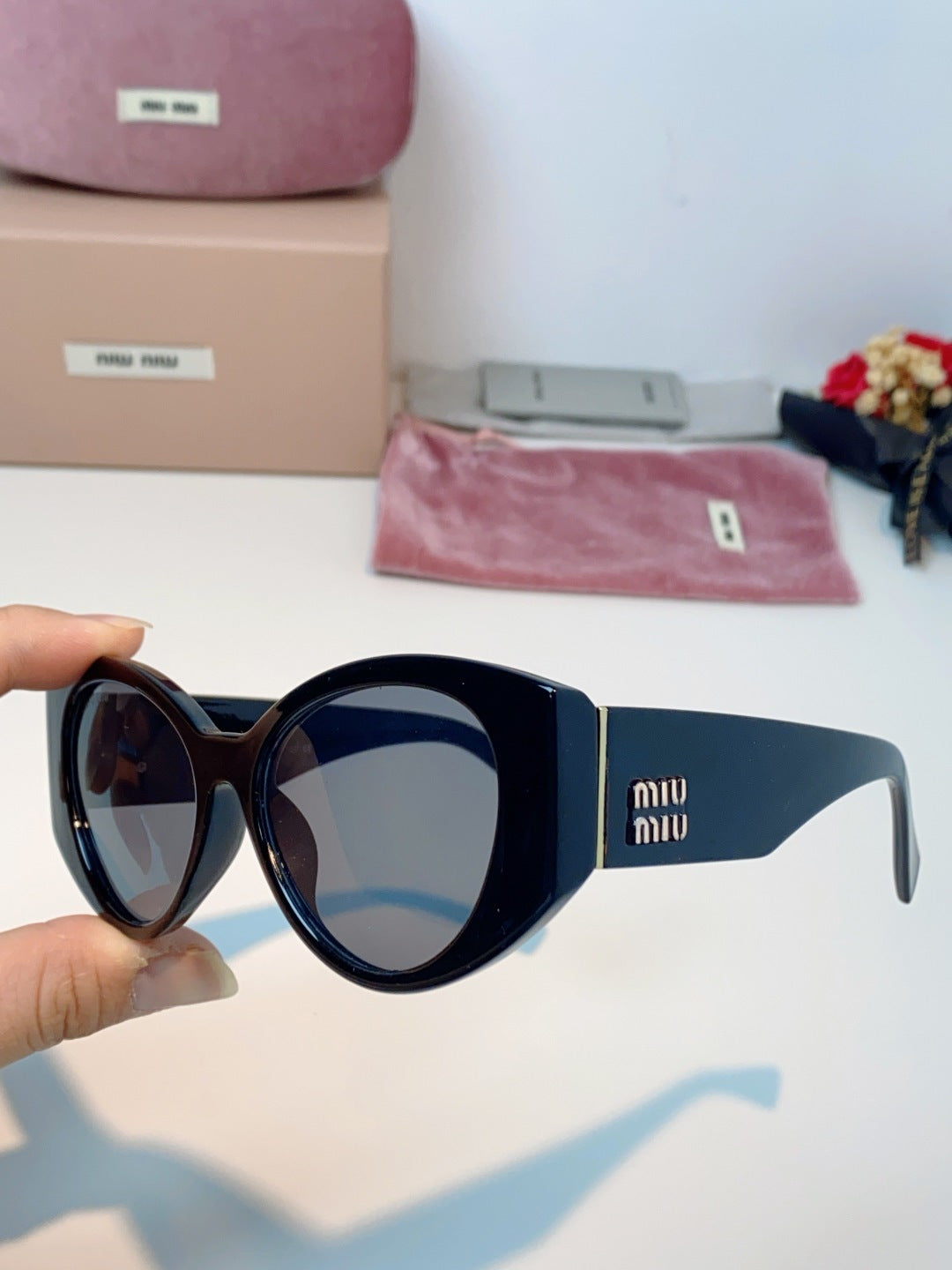 Miu Miu Polarized Cat-Eye Black Lens Sunglasses for Men & Women - detail image 6