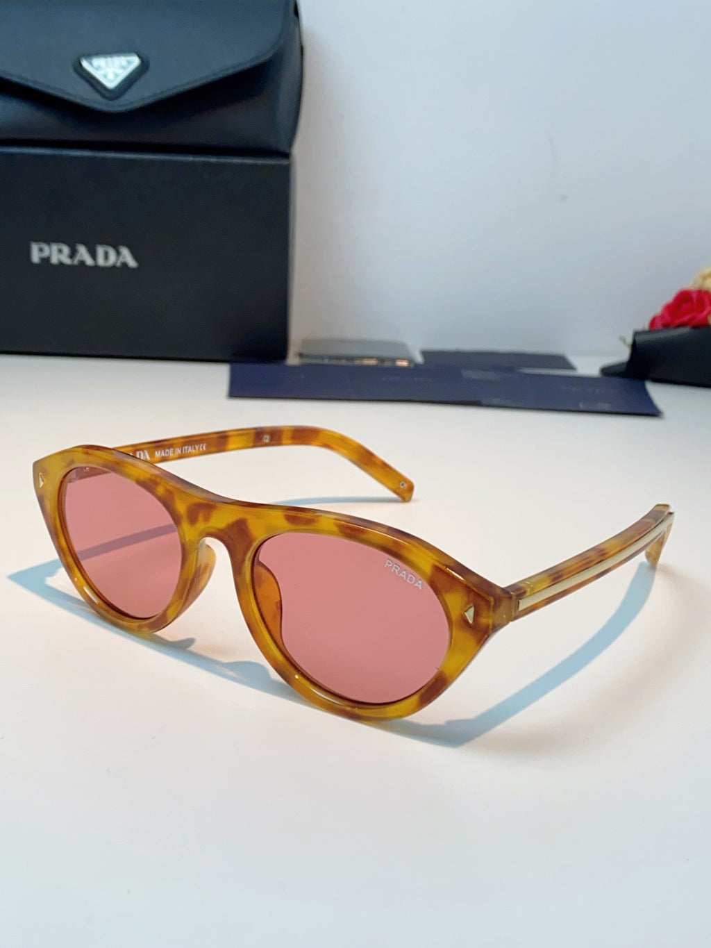 Prada Cat-Eye Orange Lens Sunglasses for Men & Women