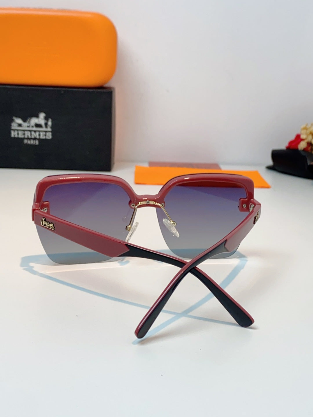 Hermès Lightweight Rimless Red Lens Sunglasses for Men & Women - detail image 3