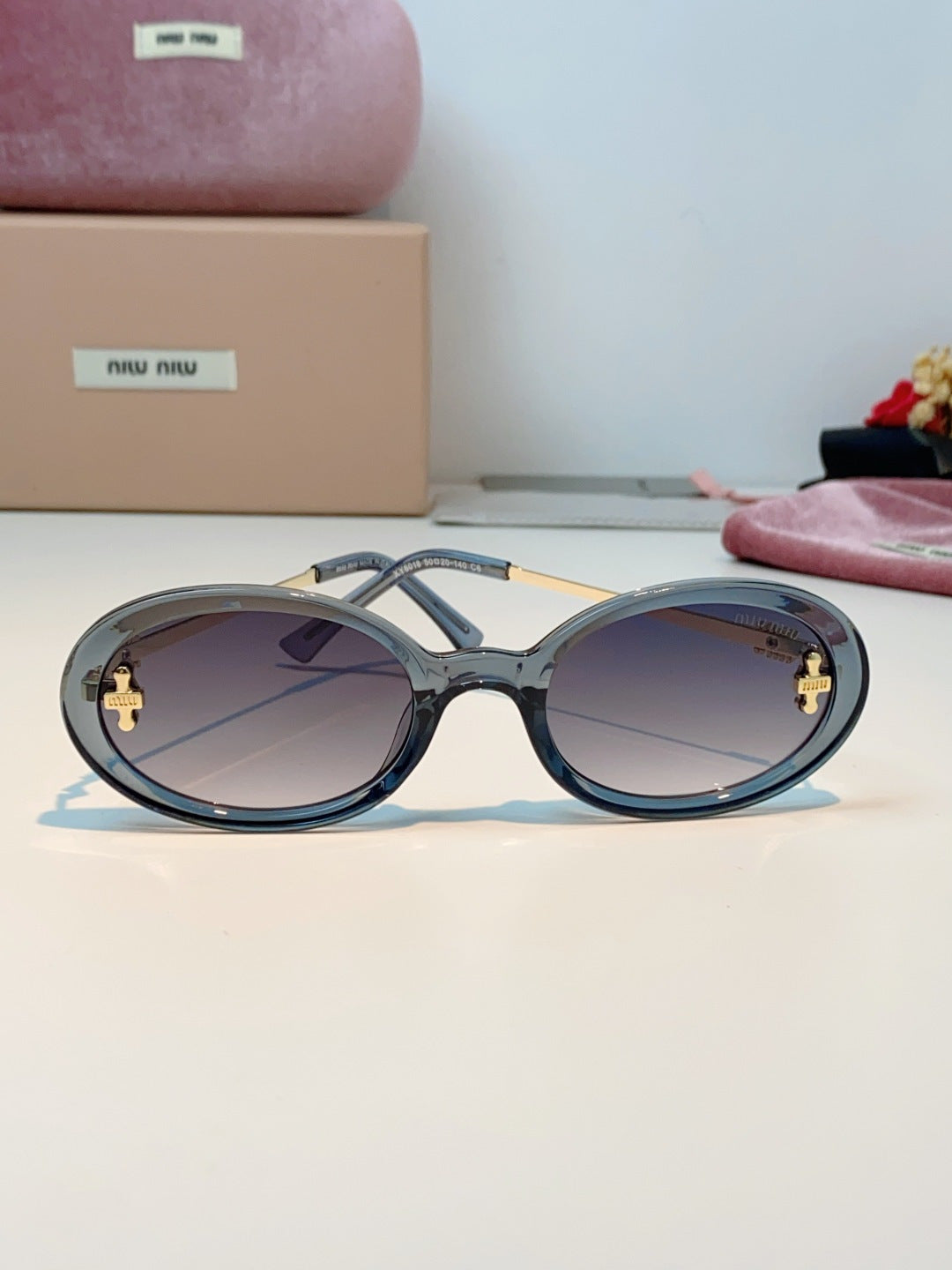 Miu Miu Metal Round Gray Lens Sunglasses for Men & Women - detail image 2