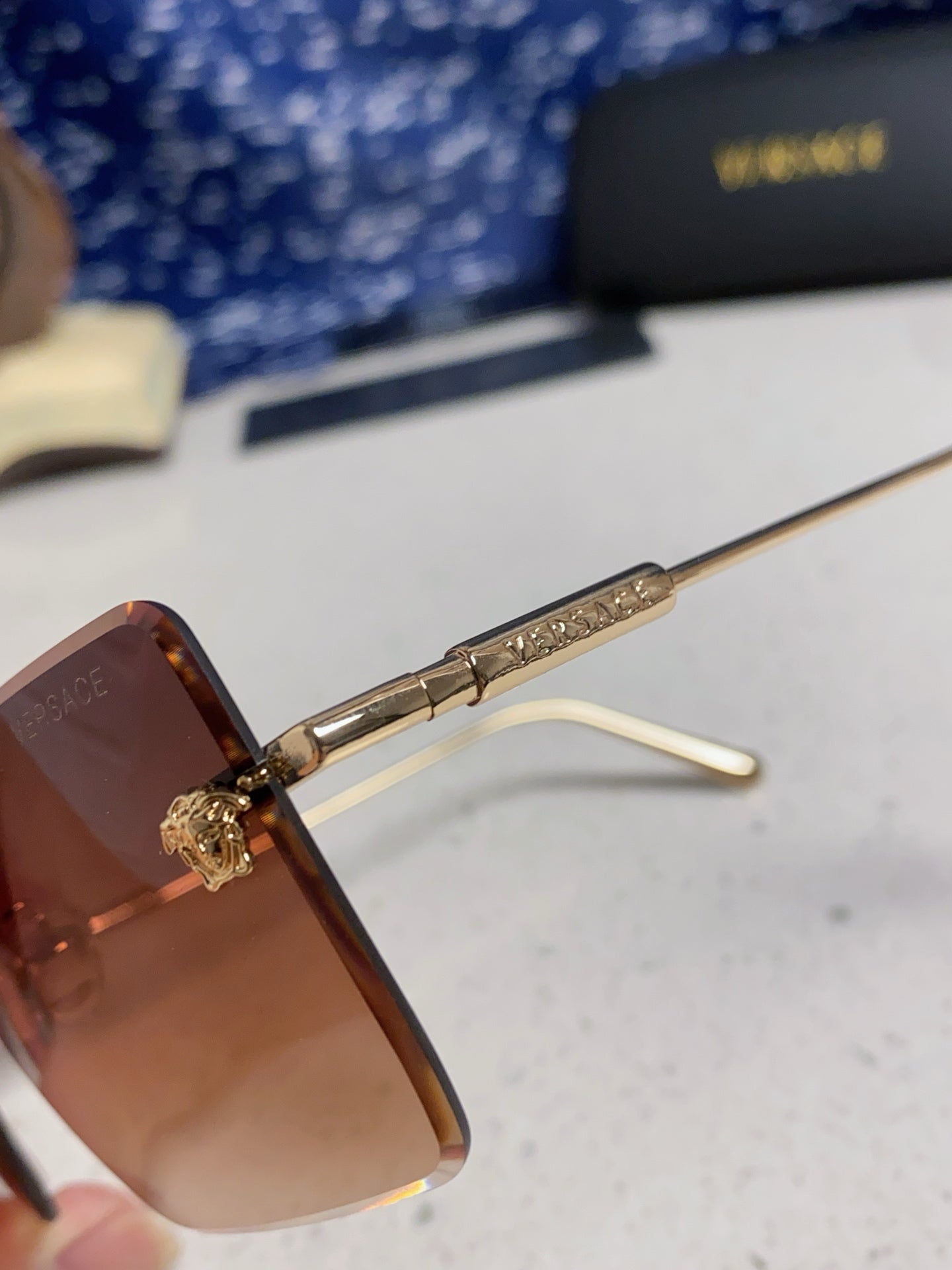 Versace Lightweight Rimless Red Lens Sunglasses for Men & Women - detail image 7